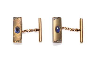 Lot 2125 - A Pair of Sapphire and Diamond Cufflinks, oblong heads inset with an oval cabochon blue...