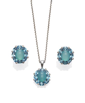 Lot 2126 - A Cluster Pendant on Chain, a greenish coloured cabochon within a border of oval blue topaz stones