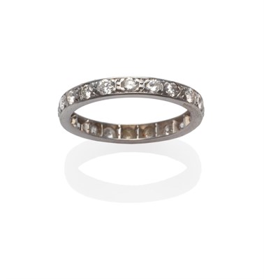 Lot 2132 - A Diamond Eternity Ring, round brilliant cut diamonds in white claw settings, within a flat...