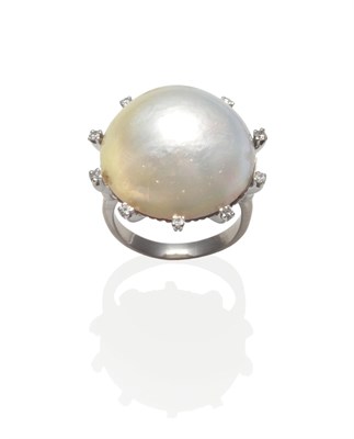 Lot 2133 - A Pearl Type Ring, a large domed mother-of-pearl within a spaced border of eight-cut diamonds,...