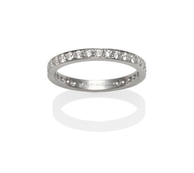 Lot 2144 - A Platinum Diamond Eternity Ring, the round brilliant cut diamonds in white claw settings, to a...