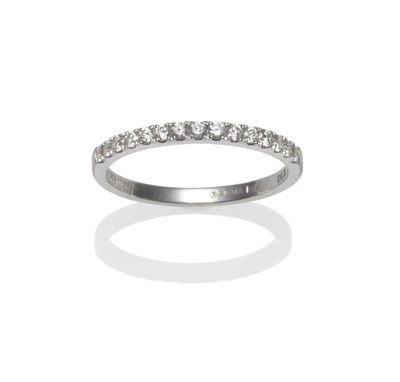 Lot 2151 - An 18 Carat White Gold Diamond Half Hoop Ring, round brilliant cut diamonds in white claw...