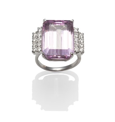 Lot 2152 - An 18 Carat White Gold Kunzite and Diamond Ring, an emerald-cut kunzite with two rows of round...