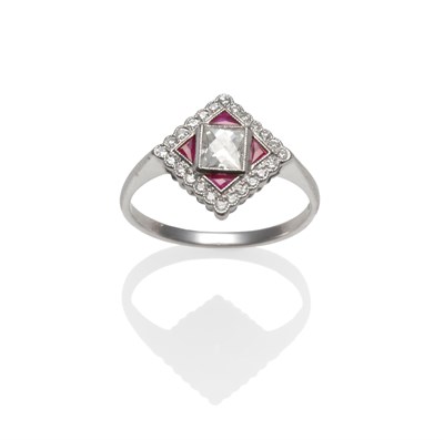 Lot 2153 - An Art Deco Style Ruby and Diamond Ring, a central scissor-cut diamond within a border of eight-cut