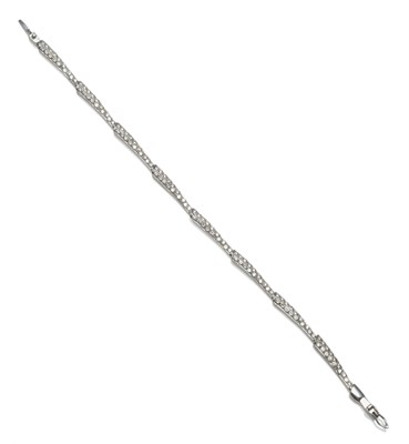 Lot 2155 - An 18 Carat White Gold Diamond Set Bracelet, of tapered links, pavé set with round brilliant...