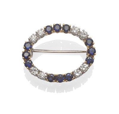 Lot 2164 - An 18 Carat Gold Sapphire and Diamond Hoop Brooch, pairs of round brilliant cut diamonds...