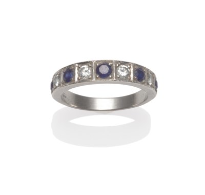 Lot 2165 - A Sapphire and Diamond Half Hoop Ring, five graduated round cut sapphires alternate with round...