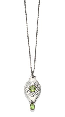 Lot 2172 - An Art Nouveau Pendant, by Murrle Bennet, the hammered drop with a round green paste centrally...