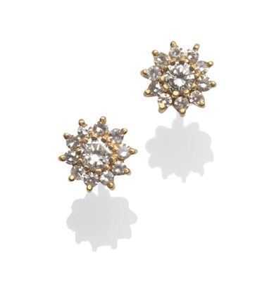 Lot 2185 - A Pair of Diamond Cluster Earrings, a round brilliant cut diamond within a border of eight-cut...