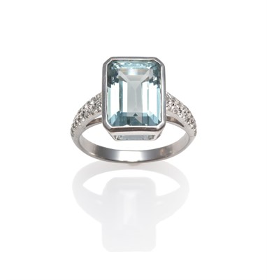 Lot 2194 - An Aquamarine and Diamond Ring, the emerald-cut aquamarine in a white rubbed over setting, to pavé