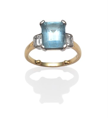 Lot 2196 - An Aquamarine and Diamond Three Stone Ring, the emerald-cut aquamarine between an emerald-cut...