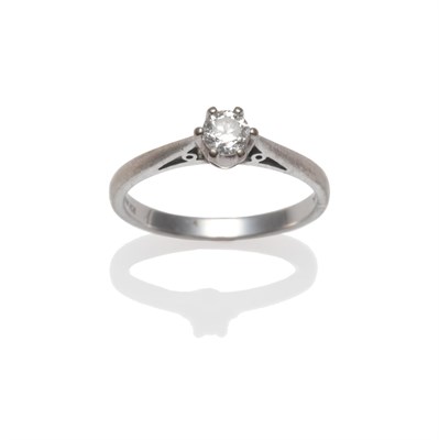 Lot 2197 - An 18 Carat White Gold Diamond Solitaire Ring, a round brilliant cut diamond in a six claw setting