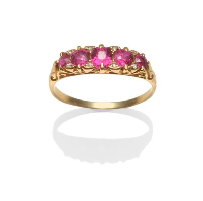 Lot 2209 - A Ruby and Diamond Ring, five graduated mixed cut rubies with rose cut diamond accents, in...