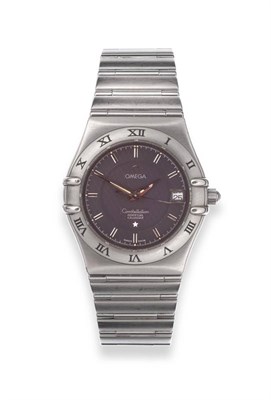 Lot 2255 - A Stainless Steel Calendar Centre Seconds Wristwatch, signed Omega, Constellation, circa 1998,...