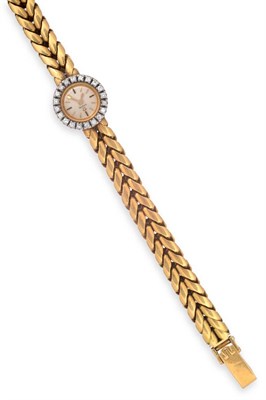 Lot 2264 - A Lady's 18ct Gold Diamond Set Wristwatch, signed Omega, circa 1965, lever movement, silvered...