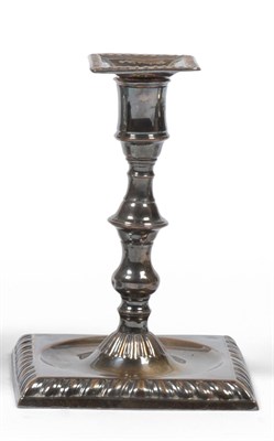 Lot 2325 - An Early Old Sheffield Plate Candlestick, maker's mark IH, 18th century, the square base with...