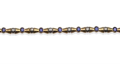 Lot 2010 - A Sapphire and Diamond Bracelet, oval cut sapphires in yellow half rubbed over settings,...