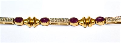 Lot 2014 - A Ruby and Diamond Bracelet, oval cabochon rubies in yellow rubbed over settings alternating...