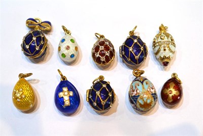 Lot 2017 - Ten Egg Charms, enamelled in assorted colours, some set with paste stones, some hinged to open