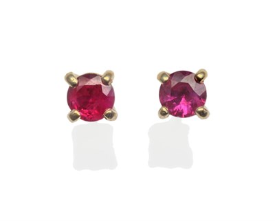 Lot 2020 - A Pair of Ruby Stud Earrings, round cut rubies in yellow claw settings, with post fittings