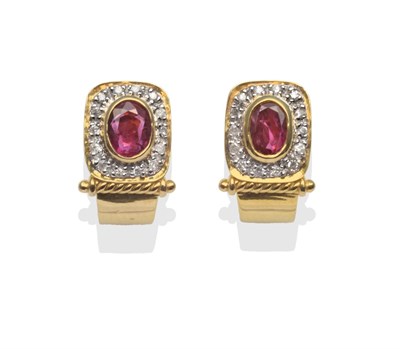 Lot 2021 - A Pair of Ruby and Diamond Earrings, an oval ruby in a yellow rubbed over setting, within a...