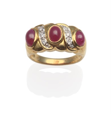 Lot 2022 - A Ruby and Diamond Ring, the scroll top set with three oval cabochon rubies in yellow rubbed...