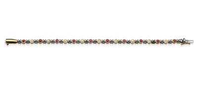 Lot 2027 - A Ruby and Diamond Bracelet, with round cabochon rubies and round brilliant cut diamonds in...