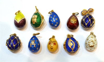 Lot 2028 - Ten Egg Charms, enamelled in assorted colours, some set with paste stones, some hinged to open