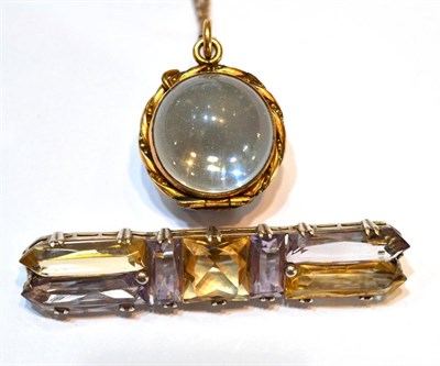 Lot 2030 - A Citrine and Amethyst Bar Brooch, a central square cut citrine flanked by baguette cut and...