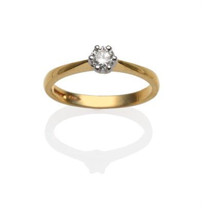 Lot 2039 - An 18 Carat Gold Diamond Solitaire Ring, the round brilliant cut diamond in a white claw...