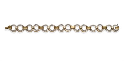 Lot 2042 - A Diamond Loop Bracelet, each link with a round brilliant cut diamond in yellow rubbed over...