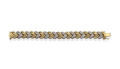 Lot 2043 - A Diamond Bracelet, of alternating white and yellow fancy links, the white links inset with...