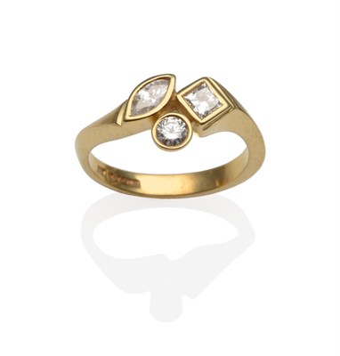 Lot 2053 - An 18 Carat Gold Multi Diamond Set Ring, with a marquise cut, princess cut and round brilliant...