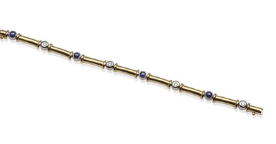 Lot 2056 - A Sapphire and Diamond Bracelet, set with round cabochon sapphires in white rubbed over...