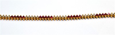 Lot 2060 - A Ruby and Diamond Bracelet, alternating series of round cut rubies and round brilliant cut...