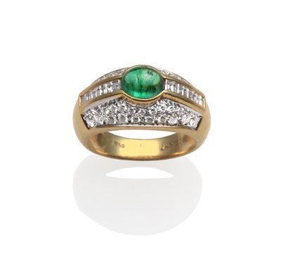 Lot 2063 - An Emerald and Diamond Ring, with an oval cabochon emerald in a yellow rubbed over setting, flanked