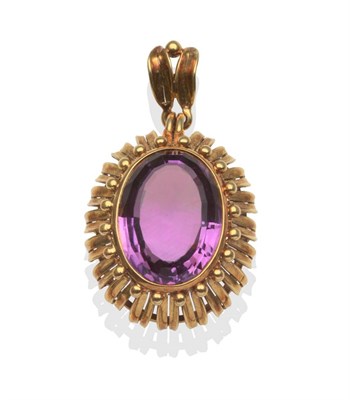 Lot 2069 - An Amethyst Pendant, oval cut amethyst in a yellow rubbed over setting with beaded and split yellow