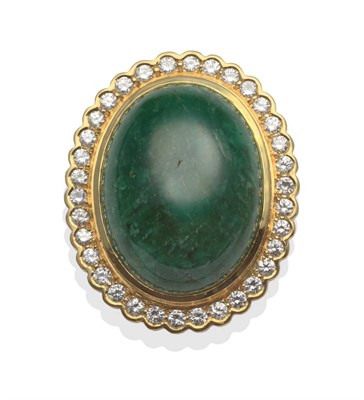 Lot 2073 - An Emerald and Diamond Brooch/Pendant, circa 1960, an oval emerald cabochon in a yellow bezel...