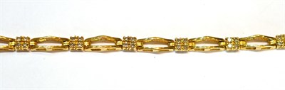 Lot 2077 - A Diamond Bracelet, square links set with round brilliant cut diamonds in yellow claw settings,...