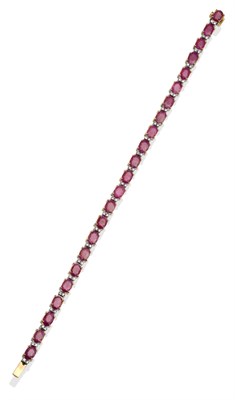 Lot 2082 - A Ruby Bracelet, set with oval rubies spaced by pairs of round brilliant cut diamonds, in...