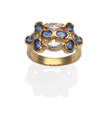 Lot 2085 - A Sapphire and Diamond Cluster Ring, eight oval cut sapphires with two marquise cut diamonds...