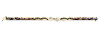 Lot 2090 - A Diamond, Sapphire, Ruby and Emerald Bracelet, yellow oblong links channel set with calibré...