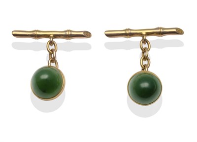 Lot 2102 - A Pair of Nephrite Set Cufflinks, two domed cabochon nephrite in yellow rubbed over settings, chain