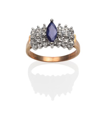 Lot 2111 - A Sapphire and Diamond Ring, with a marquise cut sapphire flanked by eight-cut diamonds in...