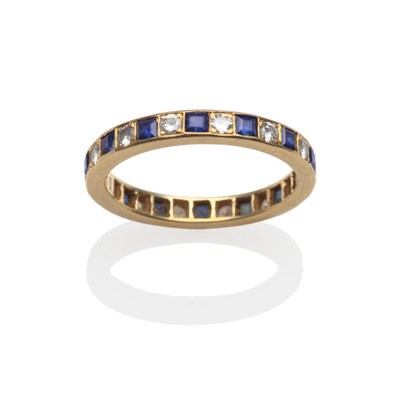 Lot 2116 - A Sapphire and Diamond Eternity Ring, with calibré cut sapphires and round brilliant cut...