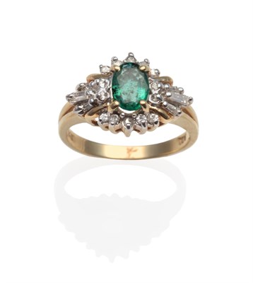 Lot 2117 - An Emerald and Diamond Cluster Ring, the central oval emerald with round brilliant cut diamond...