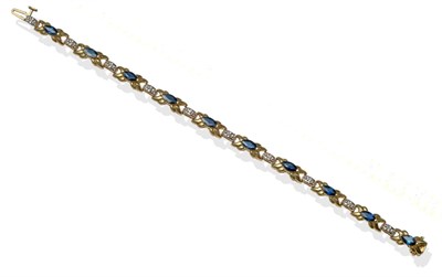 Lot 2119 - A Sapphire and Diamond Bracelet, the marquise-cut sapphires in yellow claw settings to fancy links