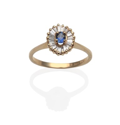 Lot 2121 - A Sapphire and Diamond Ring, an oval sapphire within a border of baguette cut diamonds, in...