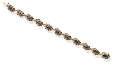 Lot 2123 - A Sapphire and Diamond Bracelet, articulated wave links set with marquise cut sapphires and...