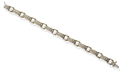 Lot 2128 - A Diamond Bracelet, of brick link form with yellow bars set with round brilliant cut diamonds...